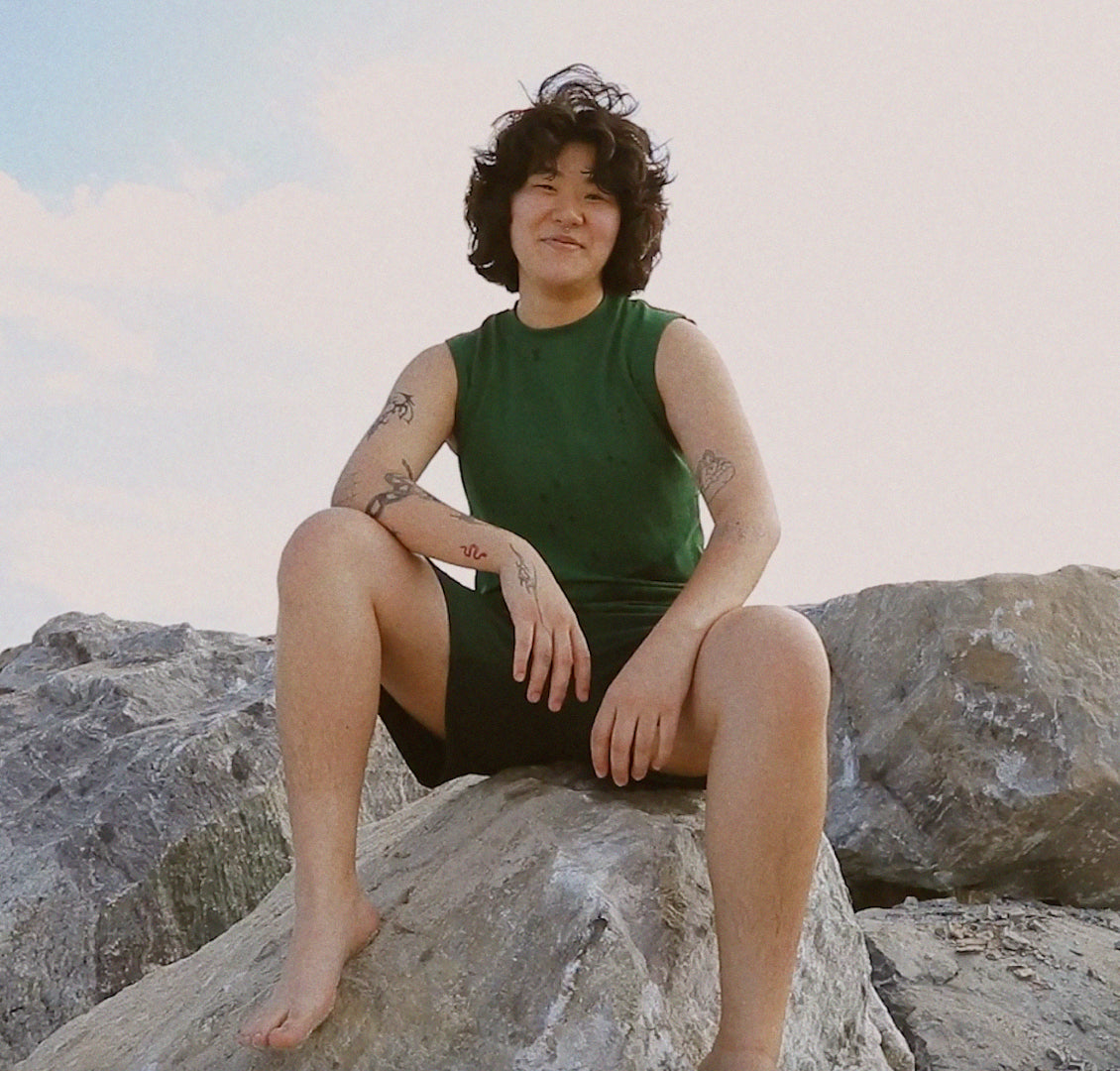 Transmasc Model Grace wearing full body swim set from Both& Apparel
