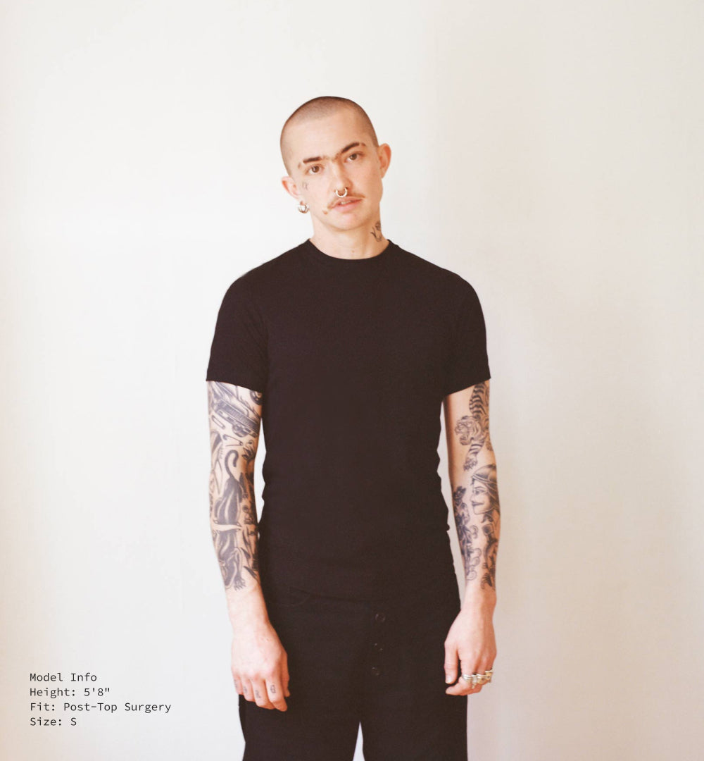 5'8" model, post-top surgery, in black S jude shirt